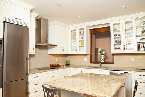 Cambria Berkeley Quartz Countertop and Cambria Berkeley Over Hang Island Top with White Glass Door Cabinets, Solid Color Ceramic Subway Tile and Stainless Steel Vent Hood